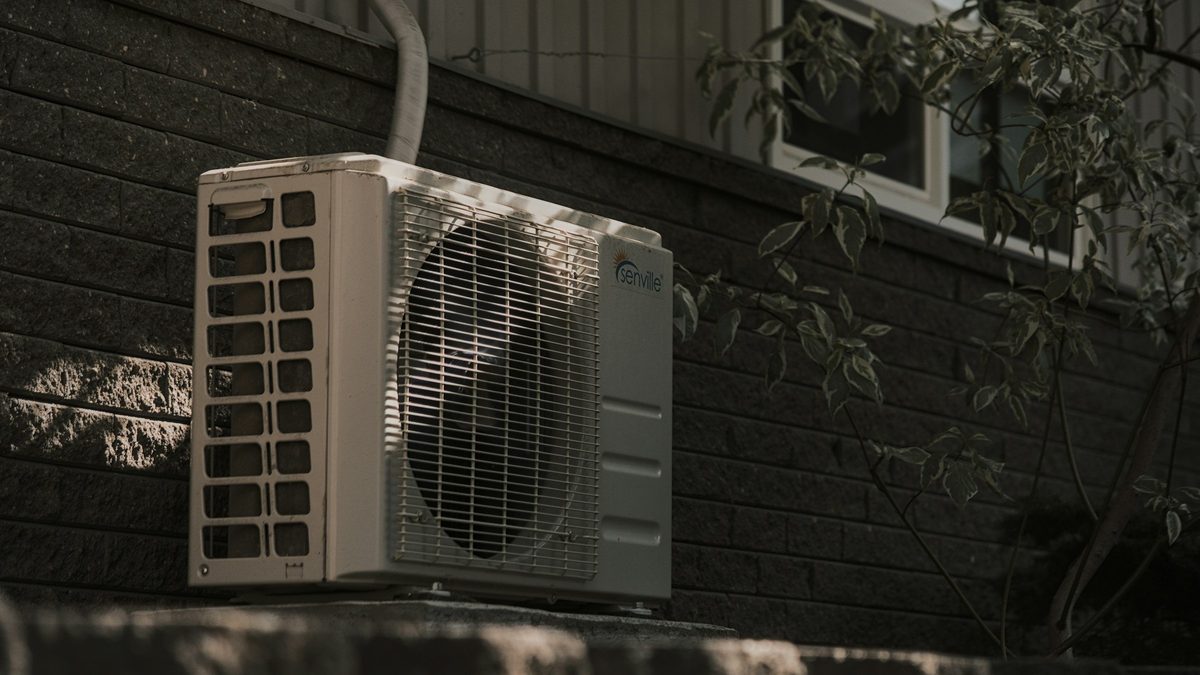 Senville outdoor condenser mounted on a brick wall to add air conditioning without ducts