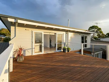 Hardwood deck off the back of a house
