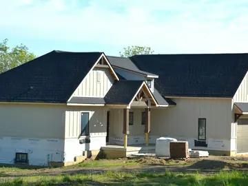 New single-story house nearly finished, wrapped and ready for siding